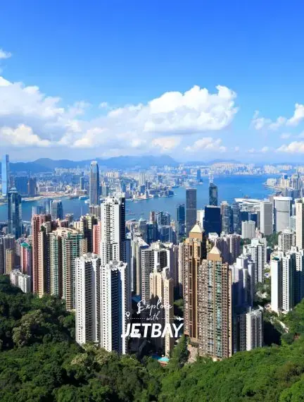 Hong Kong skyline showcasing towering skyscrapers and Victoria Harbour from elevated viewpoint
