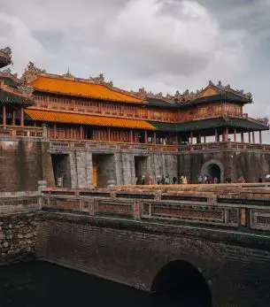 Historic Imperial City palace complex in Hue showcasing traditional Vietnamese architecture and ornate rooftops