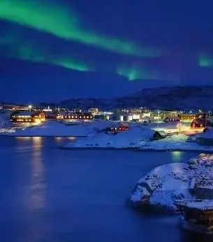 Ilulissat skyline and landmark attractions seen on descent during a private jet charter approach
