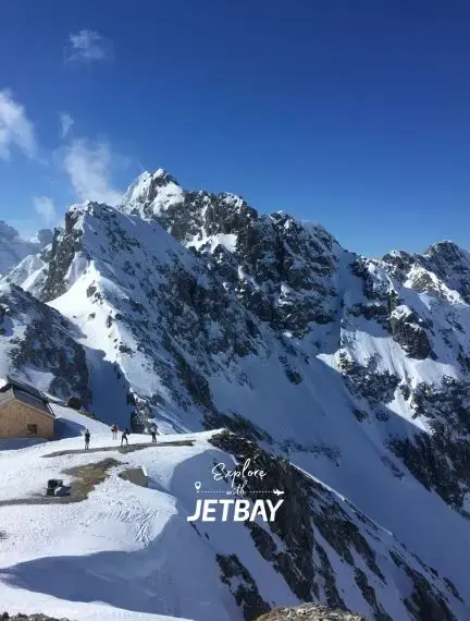 Snow-covered Alpine peaks and ski slopes in Innsbruck Austria showcasing premier winter destination