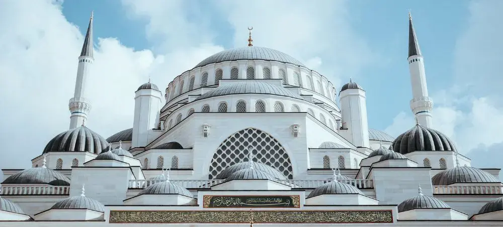 Magnificent Ottoman mosque architecture with towering minarets and ornate domes in Istanbul Turkey
