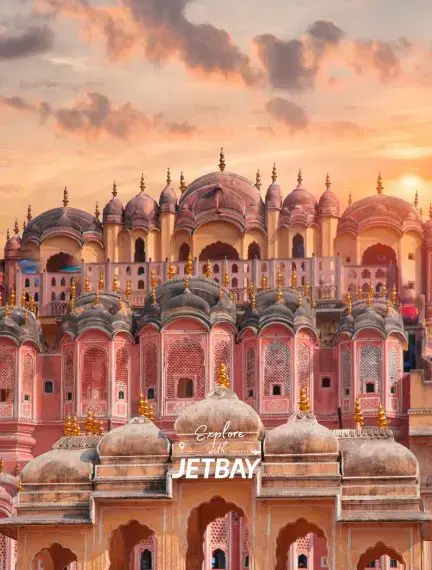 Hawa Mahal palace facade illuminated by golden sunset showcasing Jaipur's iconic Rajasthani architecture