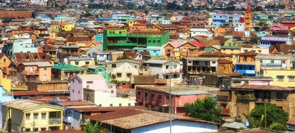 Colorful residential neighborhoods sprawling across Johannesburg hillsides showcase South Africa's vibrant urban landscape