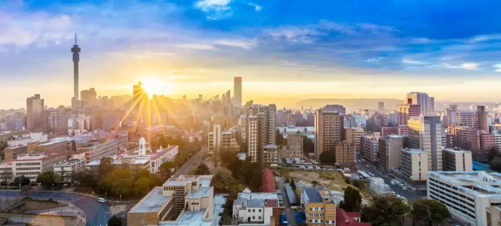 Johannesburg skyline at sunrise showcasing South Africa's vibrant urban landscape for luxury jet travel