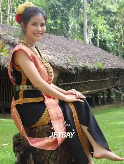 Woman in traditional Sabahan costume showcasing Kota Kinabalu's rich cultural heritage and customs