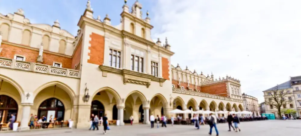Historic Cloth Hall with Renaissance arches in Krakow's Main Market Square, a premier destination for luxury travel