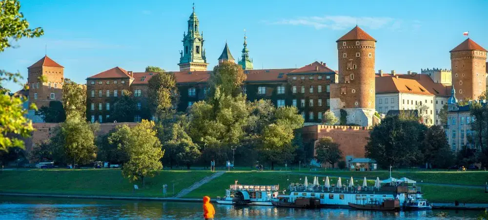 Wawel Castle complex overlooking Vistula River in Krakow with historic towers and royal architecture