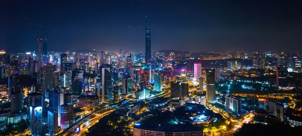 Kuala Lumpur skyline illuminated at night showcasing modern skyscrapers and vibrant city lights