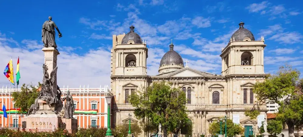 Historic La Paz cathedral and monument in main plaza showcasing Bolivia's colonial architecture and culture