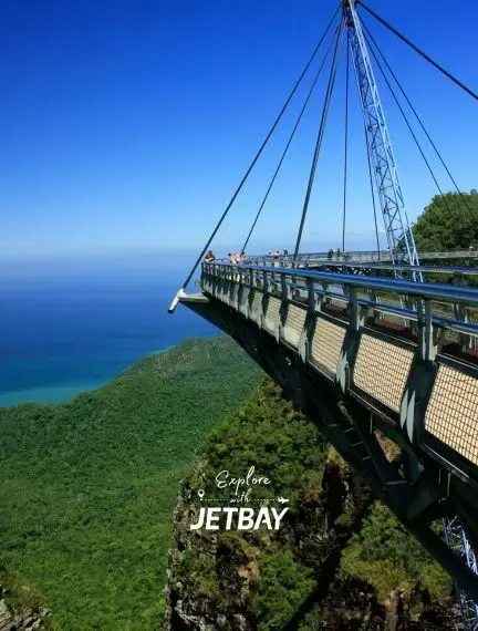 Langkawi Sky Bridge suspended over lush tropical rainforest with azure ocean views in Malaysia