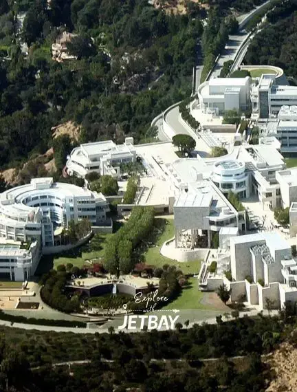Aerial view of Getty Center's modern white architecture and gardens overlooking Los Angeles hills