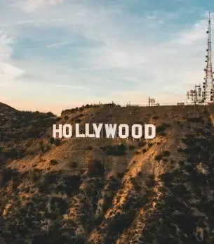 Hollywood sign on hillside at golden hour showcasing Los Angeles luxury travel destination