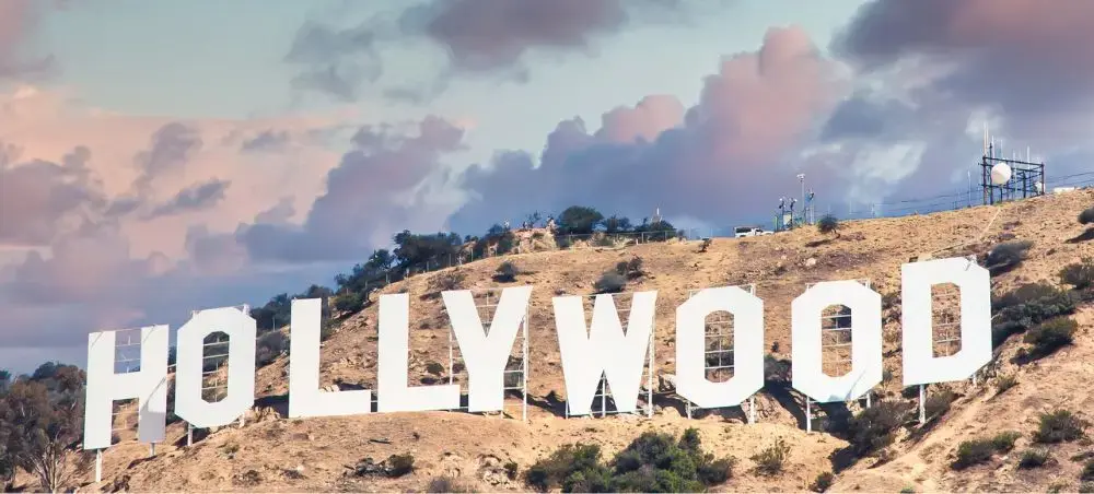 Iconic Hollywood sign on hillside overlooking Los Angeles, premier destination for luxury private jet travel