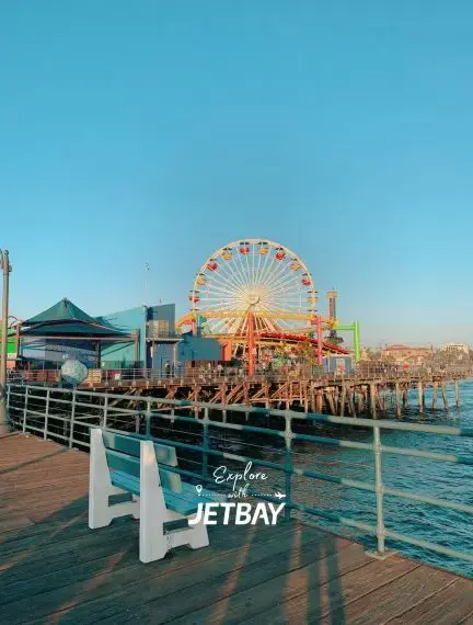Santa Monica Pier ferris wheel and amusement park overlooking Pacific Ocean in Los Angeles California