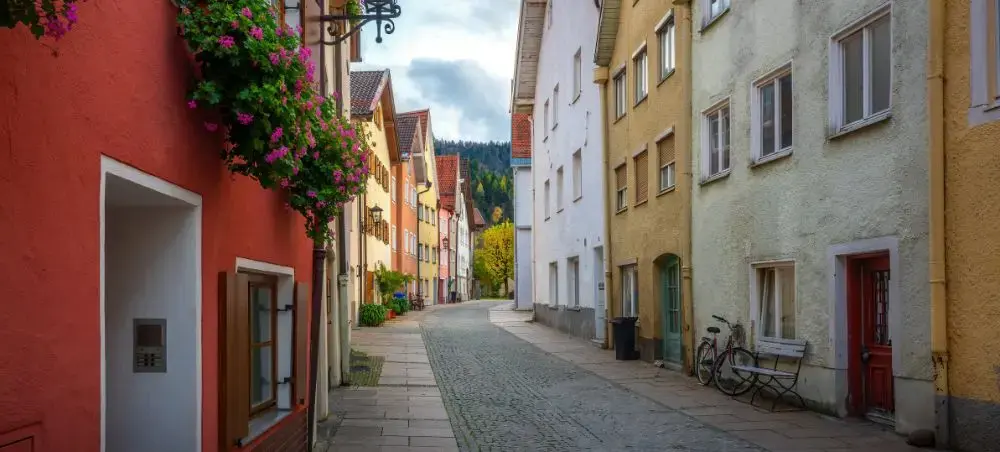 Charming cobblestone street lined with colorful traditional buildings in historic Lucerne, Switzerland