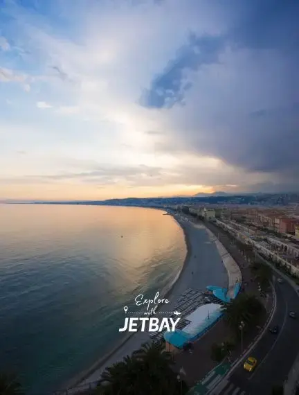 Stunning aerial view of Nice's Promenade des Anglais coastline at sunset with Mediterranean waters