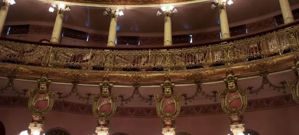 Ornate interior of historic Amazon Theatre in Manaus showcasing gilded balconies and classical columns
