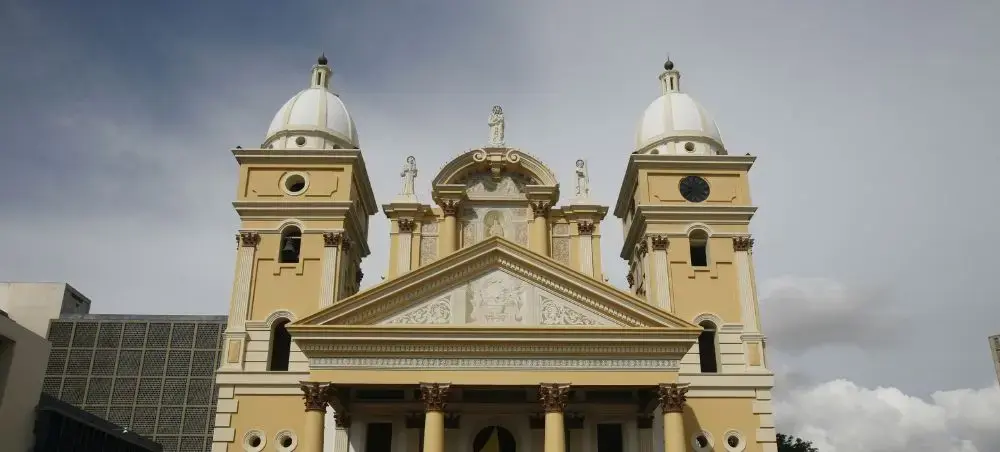 Historic colonial cathedral with twin bell towers and ornate facade in Maracaibo, Venezuela
