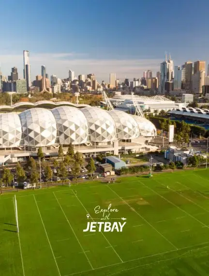 Melbourne skyline with AAMI Park's distinctive geometric domes and sports fields for luxury travel planning