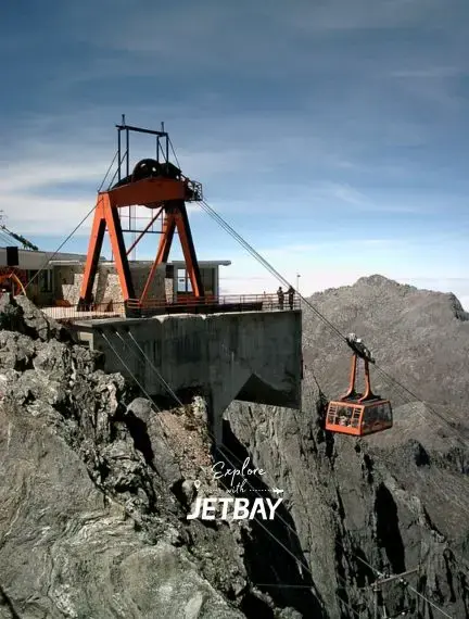 Cable car gondola suspended over dramatic rocky canyon landscape in Merida Venezuela mountains
