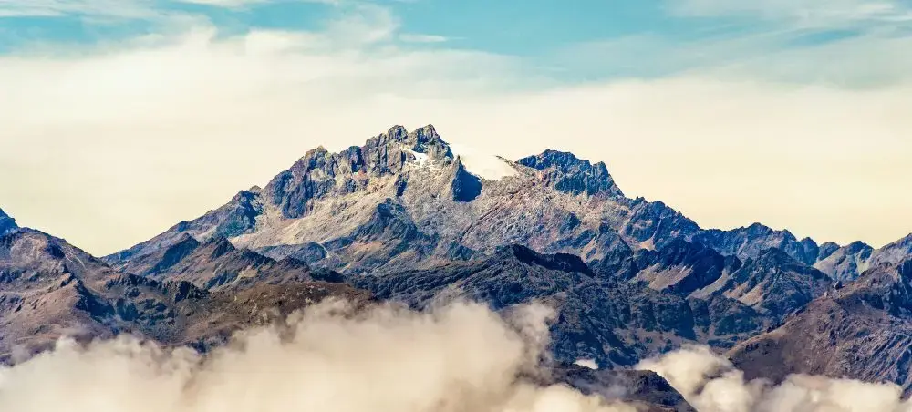 Snow-capped Andes mountains rising above clouds near Merida, Venezuela's premier highland destination