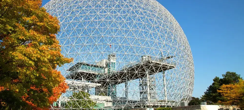 Montreal Biosphere geodesic dome with autumn foliage showcasing the city's architectural landmarks