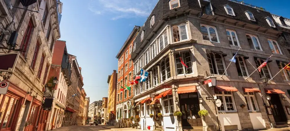 Historic cobblestone street in Old Montreal showcasing French colonial architecture and colorful buildings