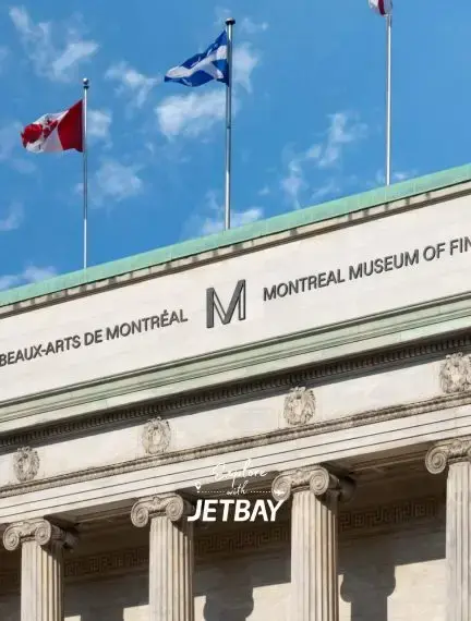 Montreal Museum of Fine Arts neoclassical facade with Canadian and Quebec flags for luxury travel guide