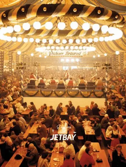 Elegant Munich beer hall with traditional Bavarian decor, string lights, and diners enjoying authentic cuisine