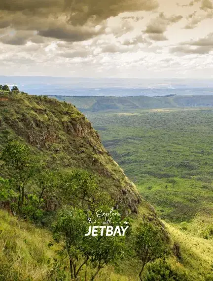Dramatic escarpment overlooking vast green valleys in Nakuru, Kenya showcasing the region's stunning landscape