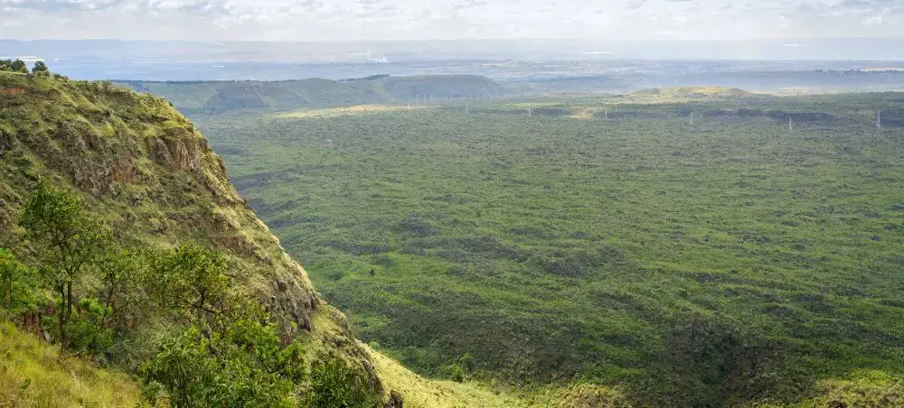 Expansive view of Nakuru's lush green valleys and escarpment cliffs showcasing Kenya's diverse landscapes