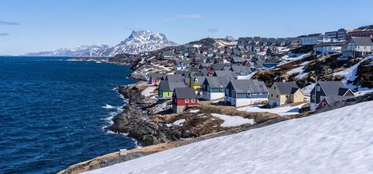 Nuuk skyline and waterfront district photographed from a private aircraft on final approach