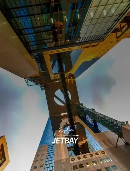 Dramatic upward view of Osaka's modern skyscrapers and architectural landmarks showcasing Japan's urban skyline