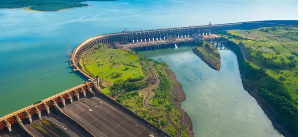 Aerial view of Itaipu Dam spanning the Paraná River between Paraguay and Brazil with turquoise waters