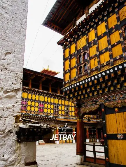 Traditional Bhutanese architecture with ornate golden woodwork and decorative patterns in historic Paro