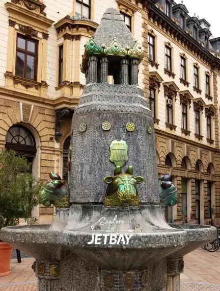 Historic Zsolnay fountain with ornate ceramic decorations in Pecs city center, Hungary destination