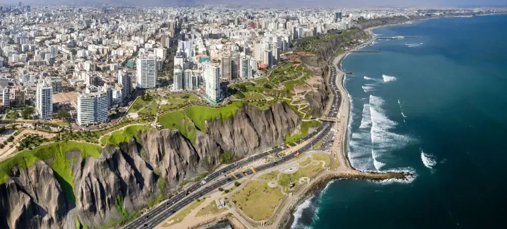 Aerial view of Lima's dramatic coastline showcasing Peru's capital city with clifftop parks and Pacific Ocean