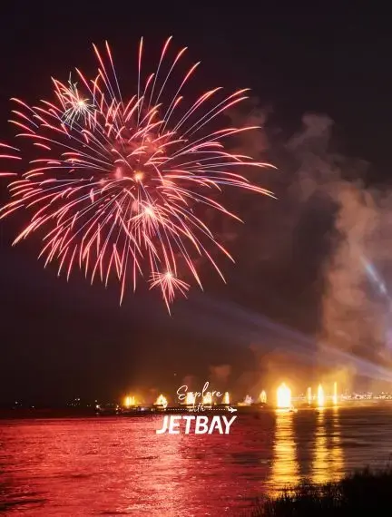 Spectacular fireworks celebration over Mekong River waterfront in Phnom Penh during festive evening