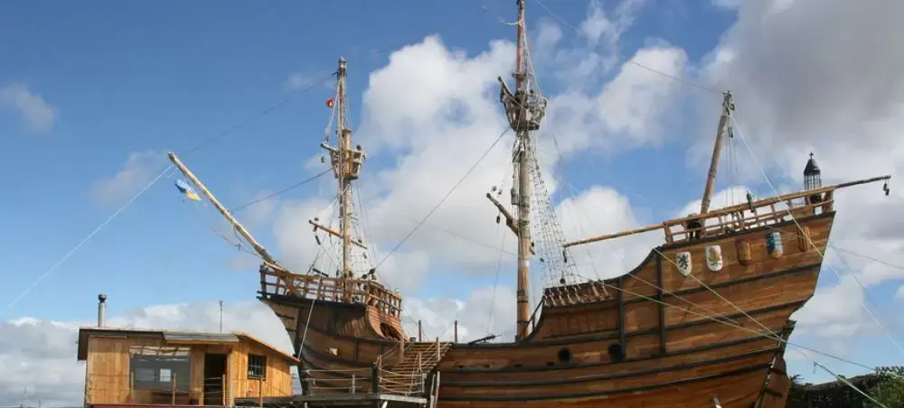 Historic wooden ship replica displaying maritime heritage at Punta Arenas waterfront museum in Chile