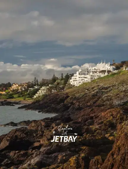 Luxury coastal villas and resorts overlooking rocky shoreline in Punta del Este, Uruguay's premier beach destination