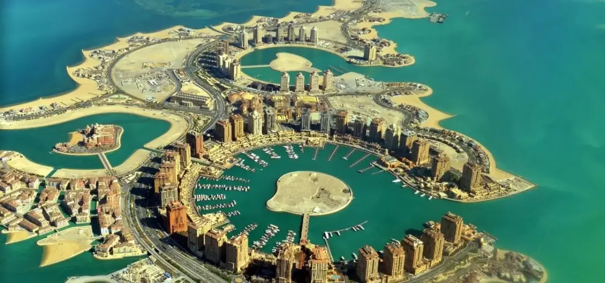 Qatar skyline and waterfront district photographed from a private aircraft on final approach