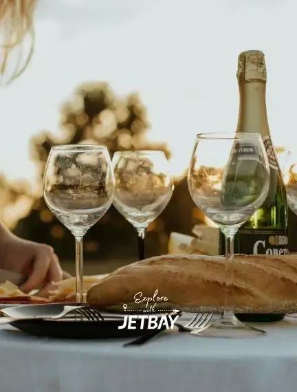 Elegant champagne service with crystal glasses overlooking Queenstown's stunning mountain landscape