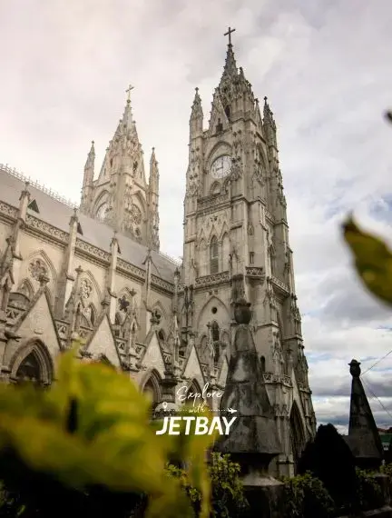 Gothic spires of Basilica del Voto Nacional cathedral towering over Quito's historic center in Ecuador