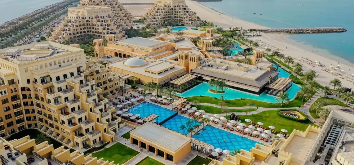 Ras Al Khaima skyline and waterfront district photographed from a private aircraft on final approach