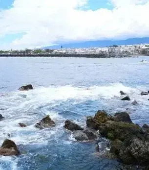 Saint Pierre City skyline and landmark attractions seen on descent during a private jet charter approach