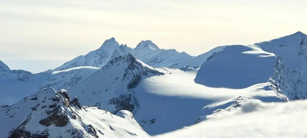 Snow-capped Austrian Alps peaks near Salzburg showcasing pristine winter mountain landscapes for luxury ski destinations