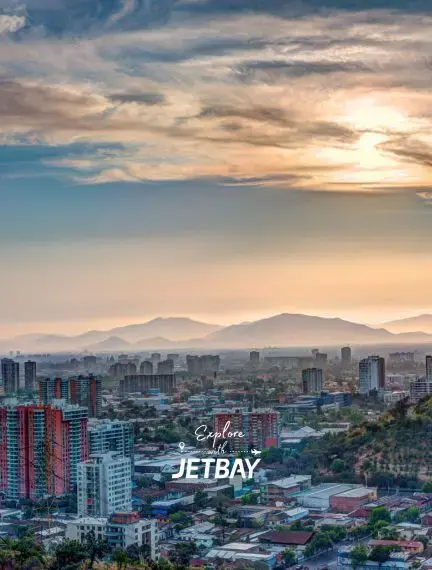 Santiago cityscape at golden hour with Andes Mountains backdrop showcasing Chile's capital for luxury travel