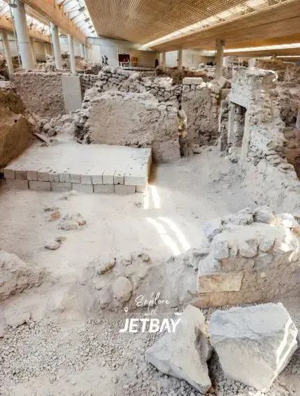 Ancient Akrotiri archaeological site in Santorini showcasing preserved Bronze Age ruins under protective shelter