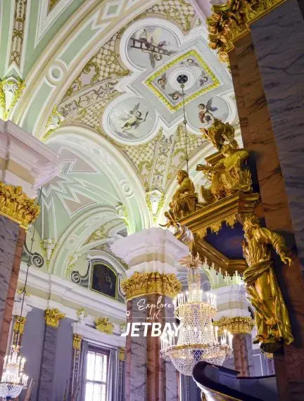 Ornate baroque cathedral interior in São Paulo featuring gilded columns and crystal chandeliers