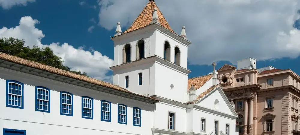 Historic colonial church with white walls and terracotta roof showcasing São Paulo's architectural heritage